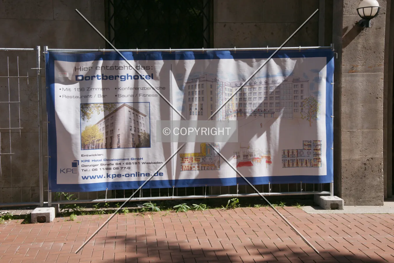 Sign illustrating the transition of the office building into a hotel