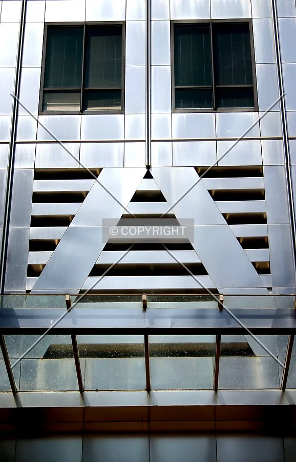 The stainless steel 'trees' above the entrance floor recall those on New York City's Twin Towers of the World Trade Center