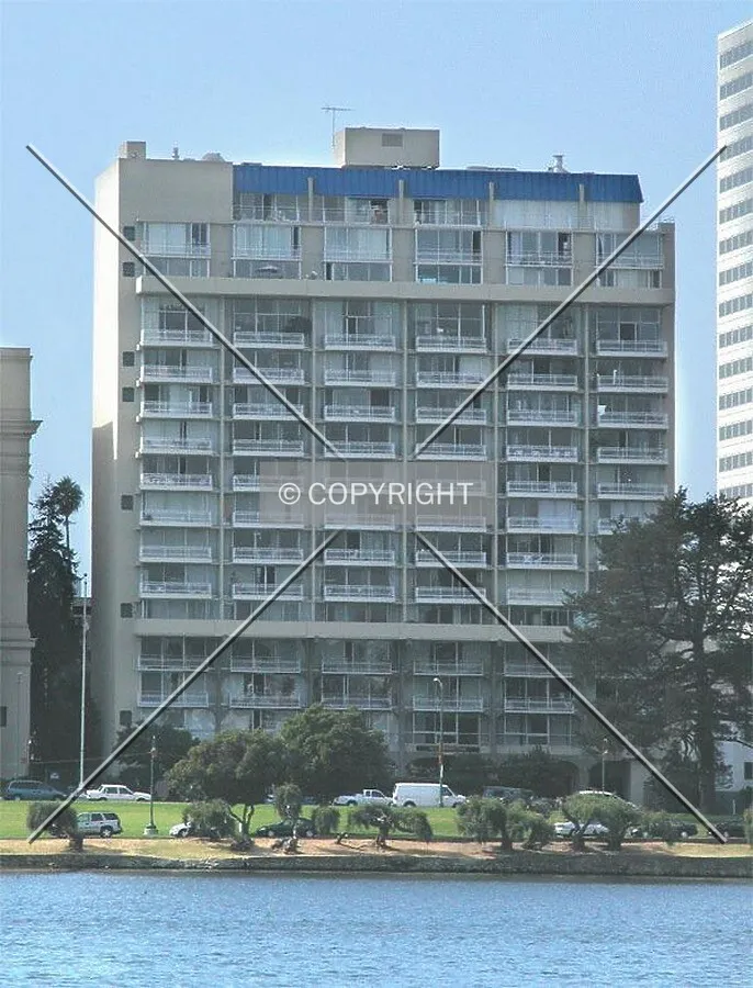 The apartment building viewed from across Lake Merritt