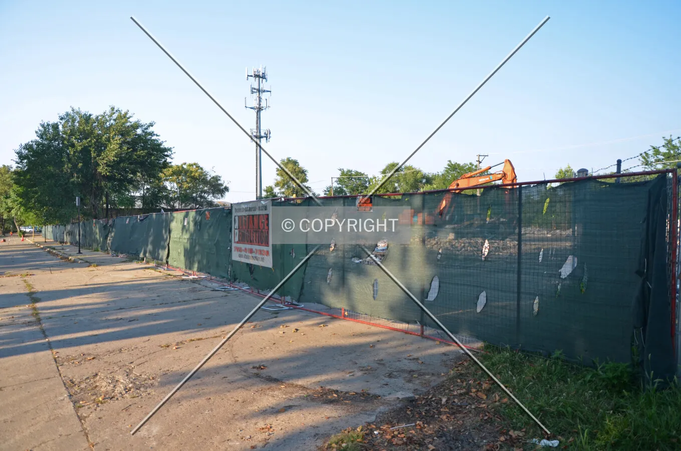 Temporary fencing along Knox Avenue during demolition, looking north; August 25, 2013.