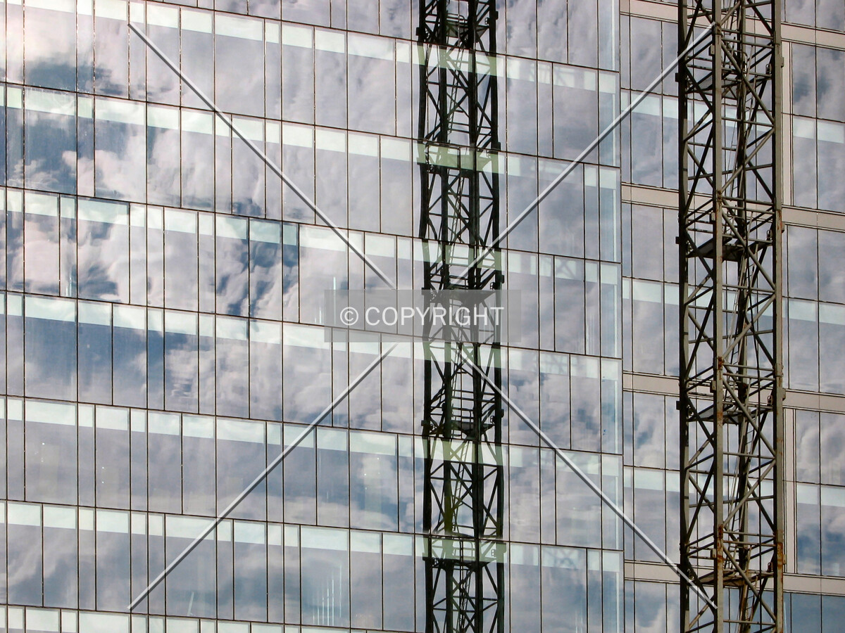 Reflecting clouds and the tower crane
