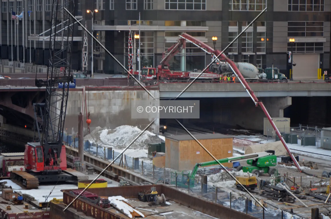 Boom of a concrete pump extended from Randolph Street during the foundation mat pour; February 14, 2015.