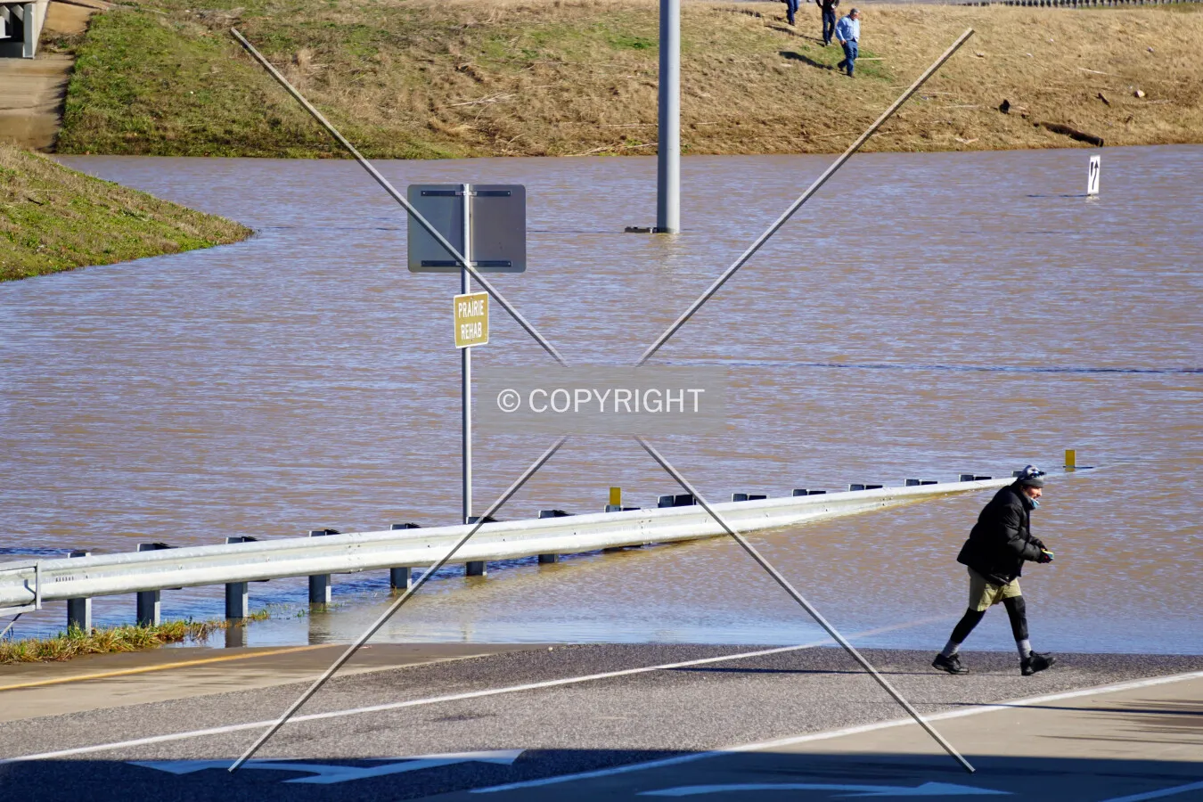 People observing and photographing the flooded Meramec River on top of Highway 141 south of the Interstate 44 overpass; January 1, 2016
