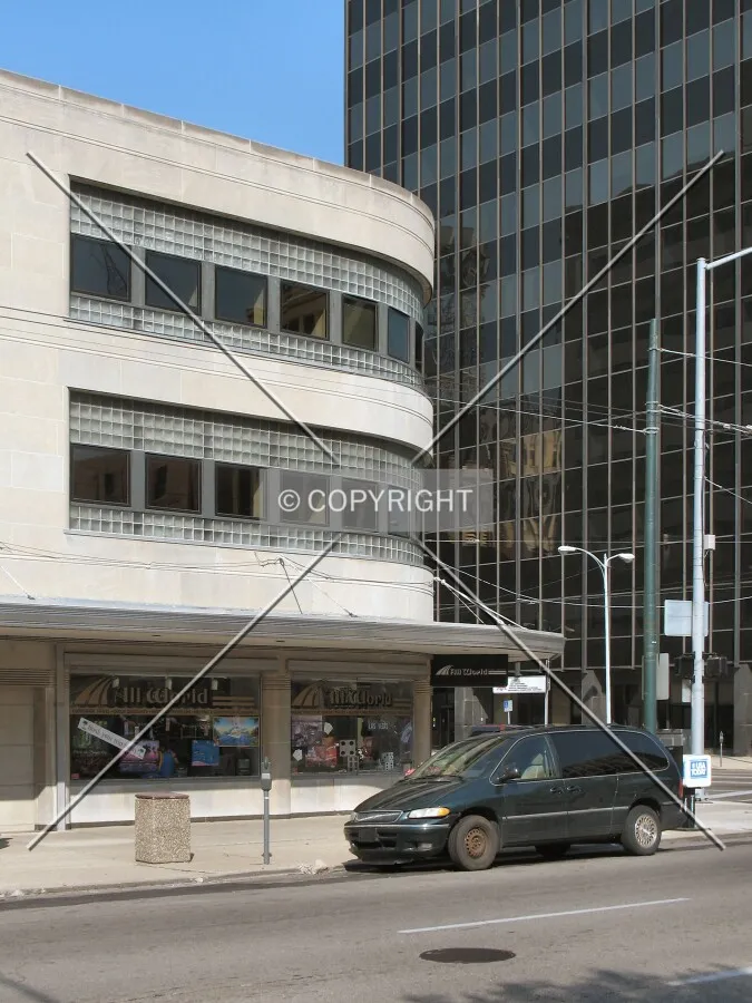 Original moderne building with its sleek curve at Ludlow and 1st Streets