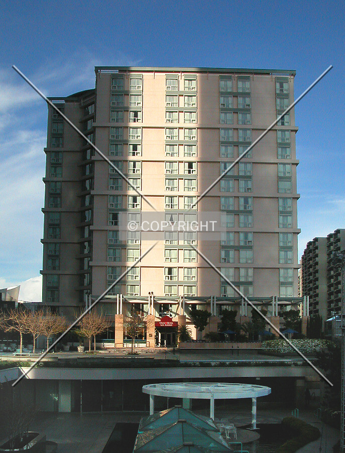 Sliiver of light from between the California Plaza towers shines on the hotel
