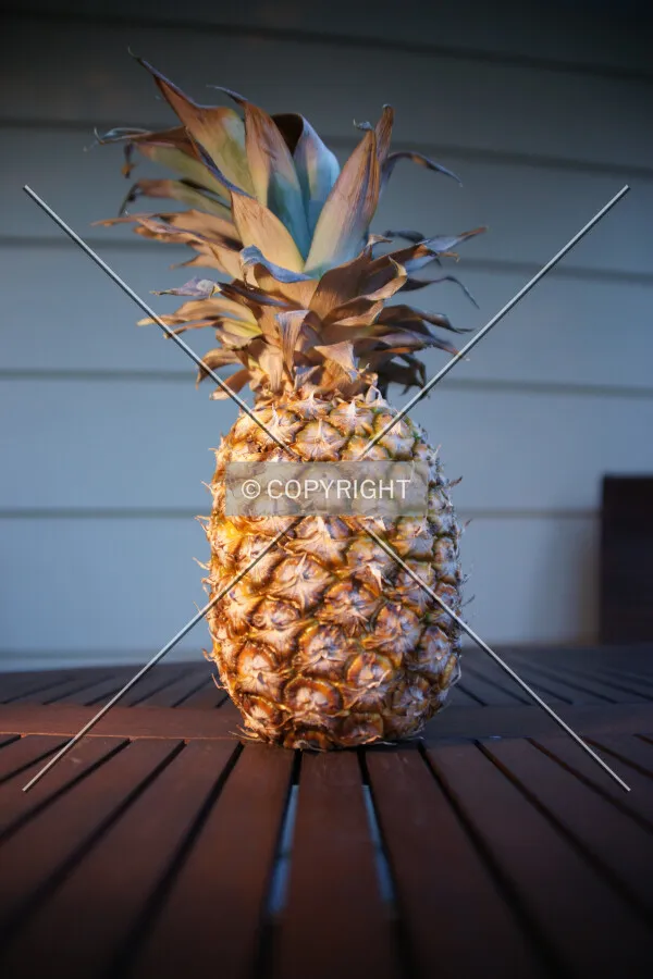 Pineapple standing on a table