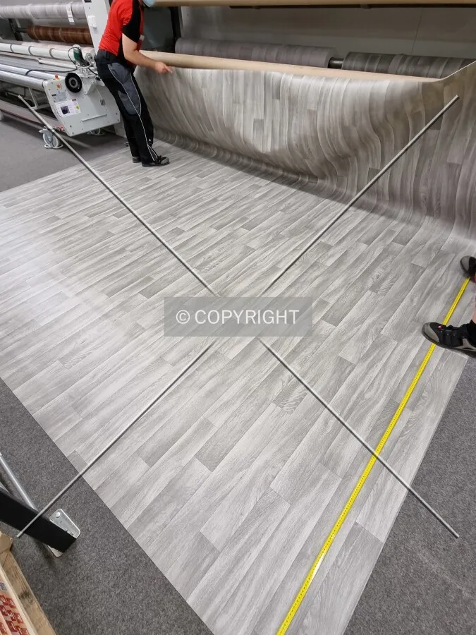 Flooring is measured in a shop