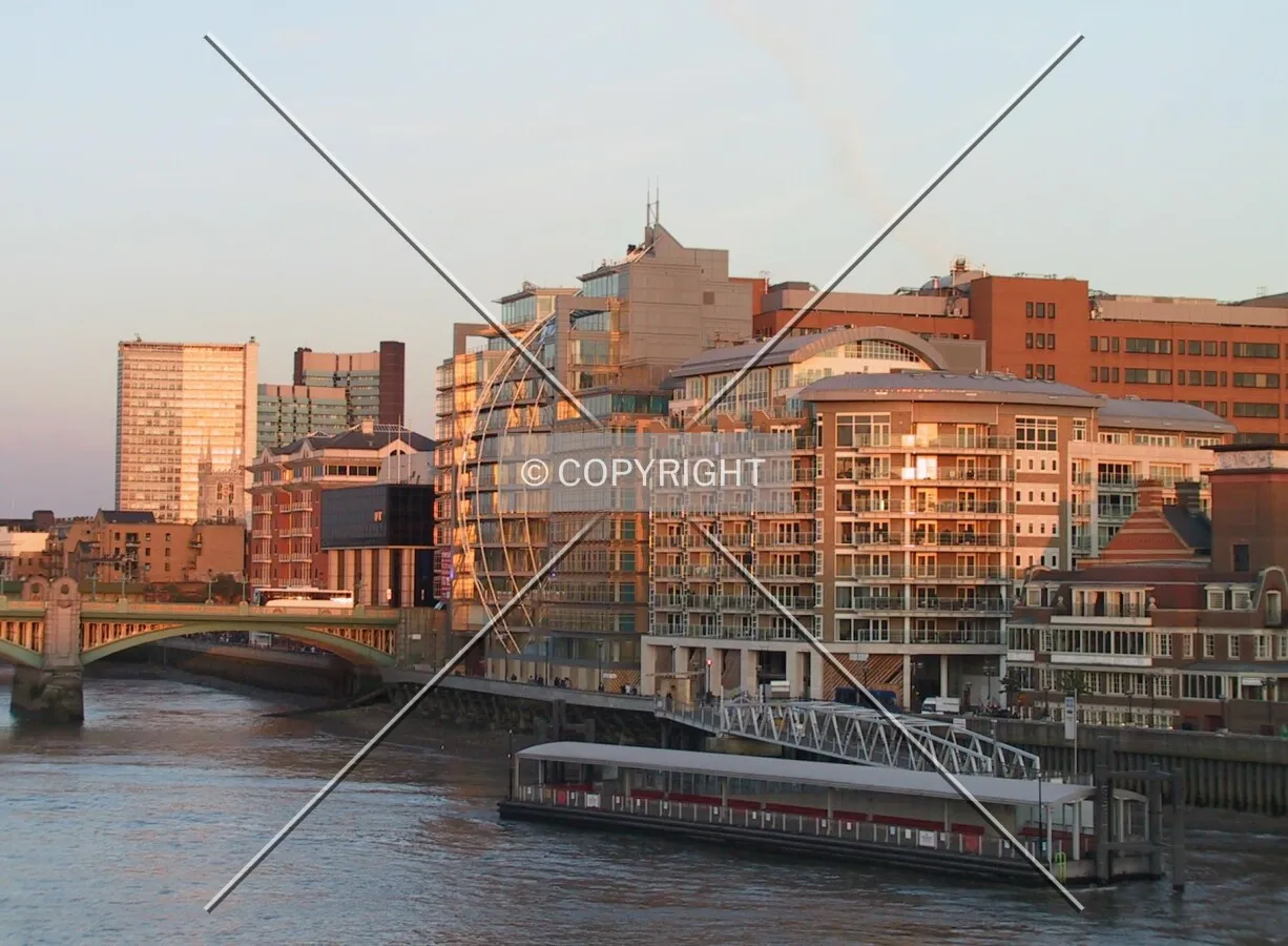 Sunset colours on buildings viewed from Millennium Bridge