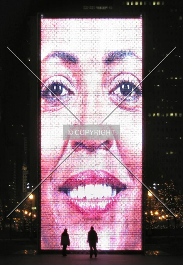 A 'Face of Chicago' smiling on Crown Fountain onlookers