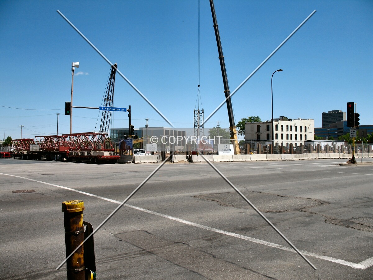 Tower crane begins to rise, from across Washington Avenue/10th Avenue South