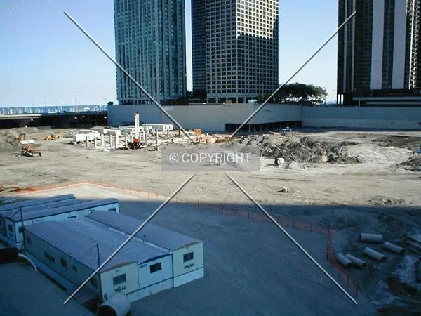 The lone tower beginning to rise across the barren landscape