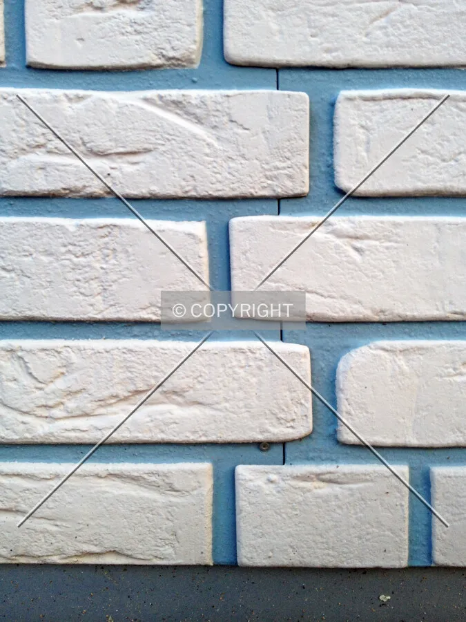 A facade which looks like brick but it plastic