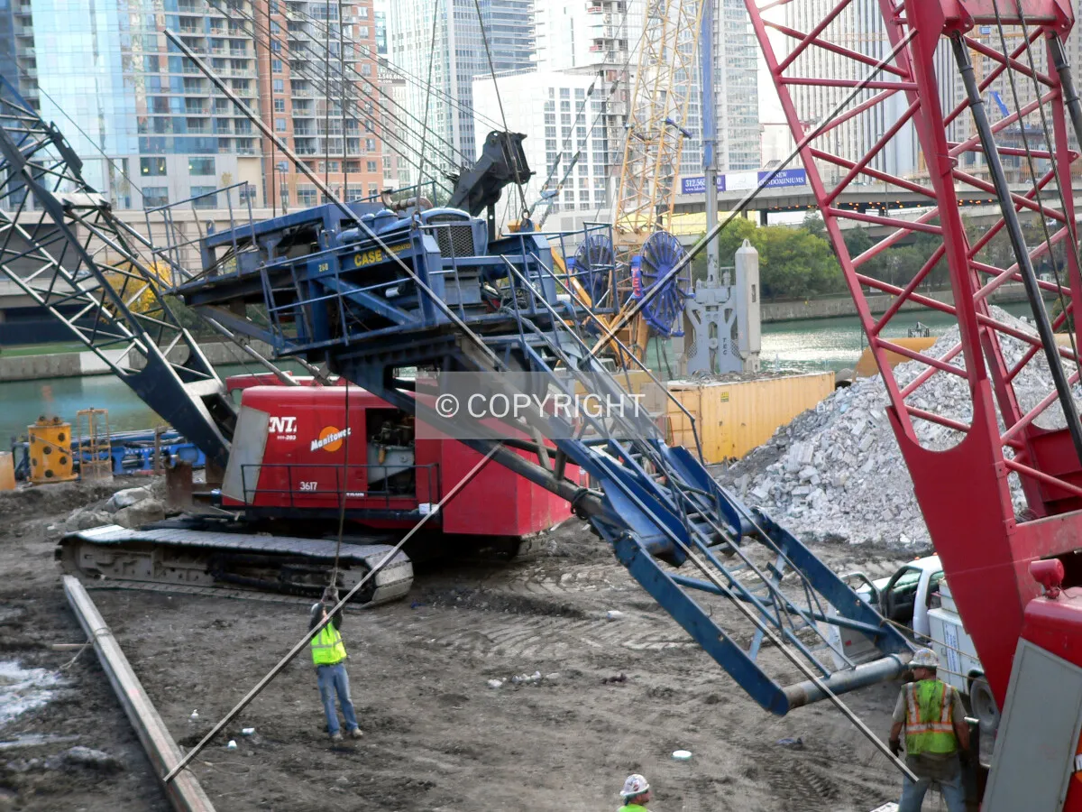 Erecting a caisson motor onto a crane