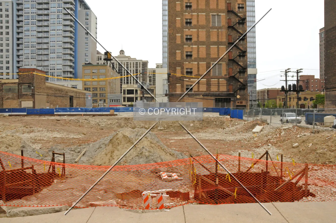 Looking east across the site from Wabash Avenue with two potholed areas in the foreground