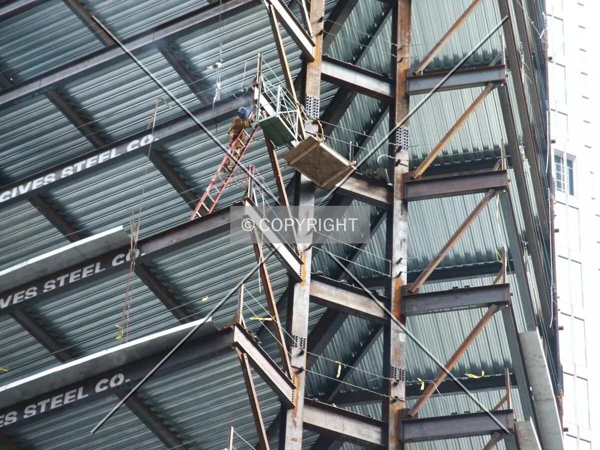 Steelworkers at the western point of the structure