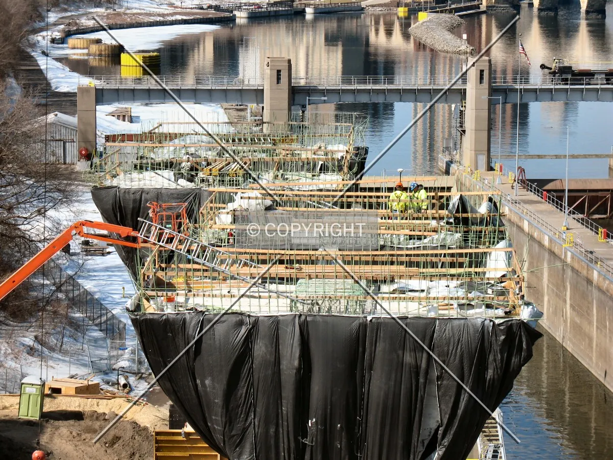 Construction workers dwarfed by Pier 2