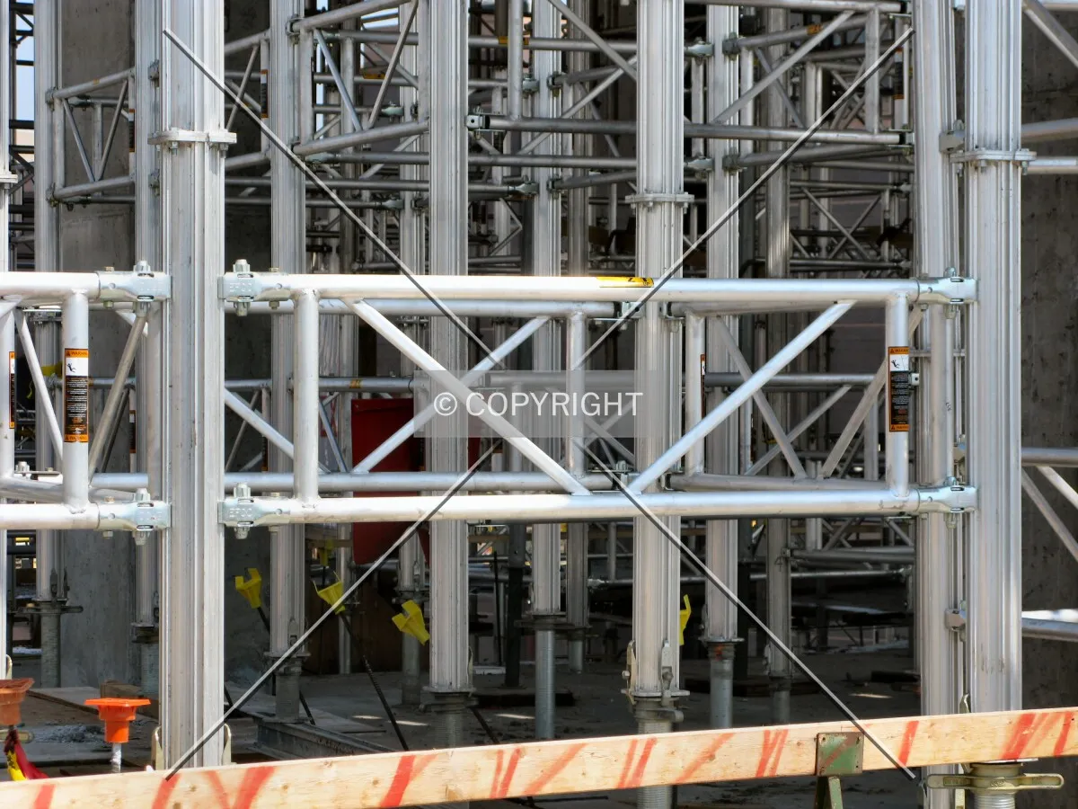 Forest of scaffolding supporting forms for the concrete structure