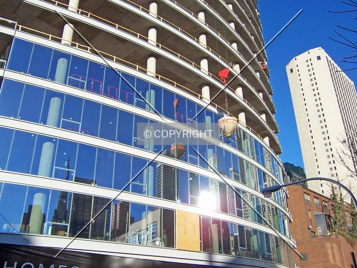 The highly reflective window glazing on the first 5 floors of the south facade