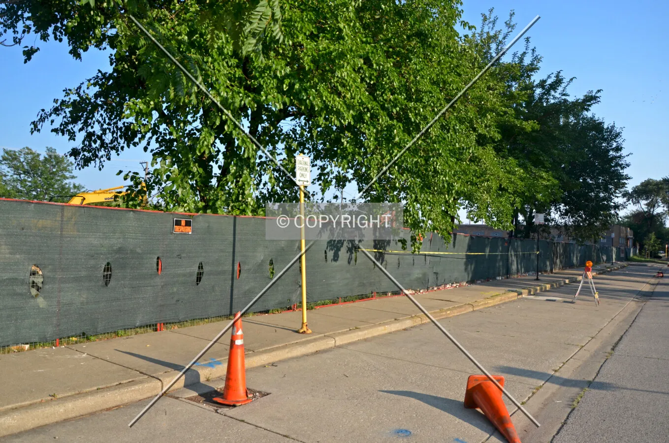 Temporary fencing along Knox Avenue during demolition, looking south. August 25, 2013.