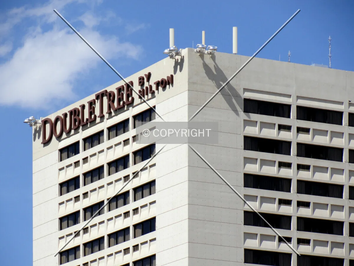Upper floors and signage from the southwest