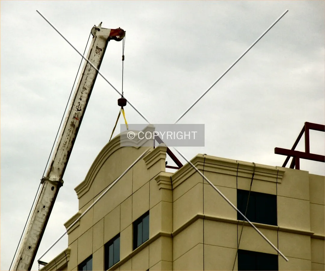 Crane installs supports for roof details