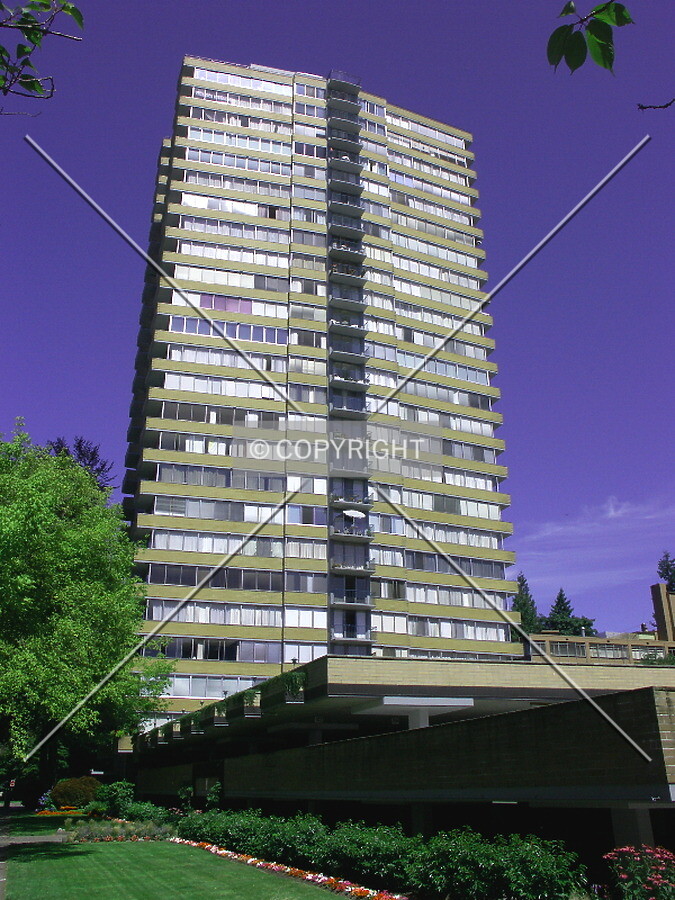 Front of building with two-level parking garage