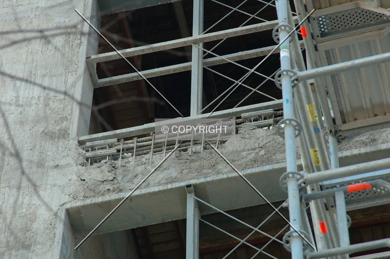 Missing concrete between two windows