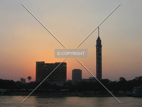 The sun sets behind Cairo Tower