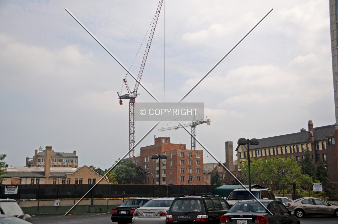 Cranes marking the location of the site, viewed from the rooftop parking deck of the Whole Foods grocery store