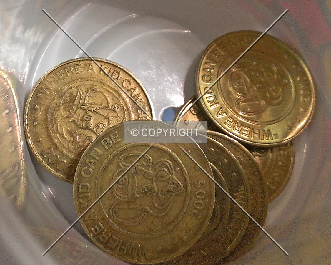 Coins in a cup at Chuck E Cheese's