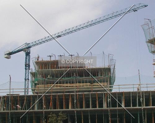 View of the building top above the low-rise sorrounding constructions