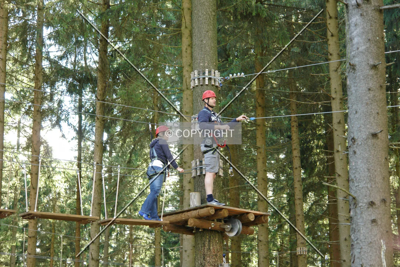 Two people climbing in a crag