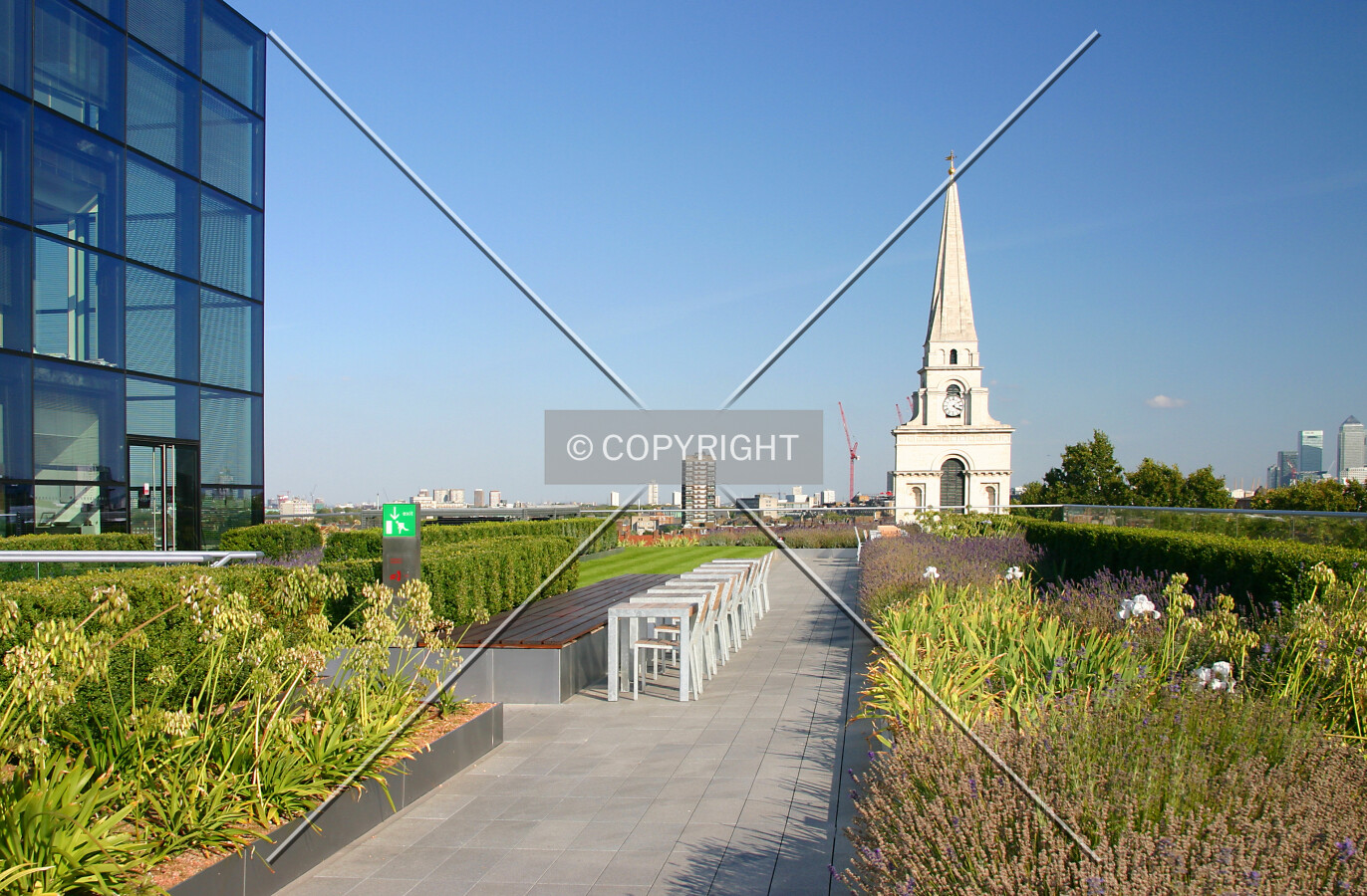 View across the sixth floor roof terrace towards Christ Church Spitalfields with Canary Wharf in the far distance at right