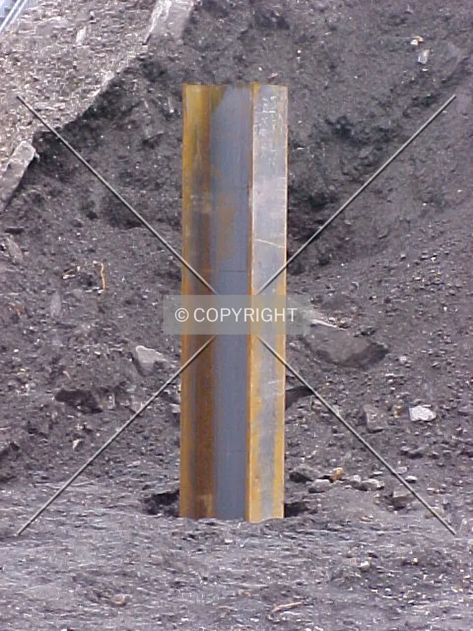 A steel pile sticking out of the ground