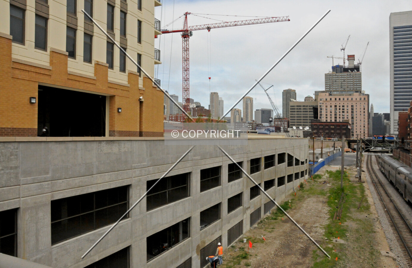 South side of the parking garage podium, looking east from Des Plaines Street