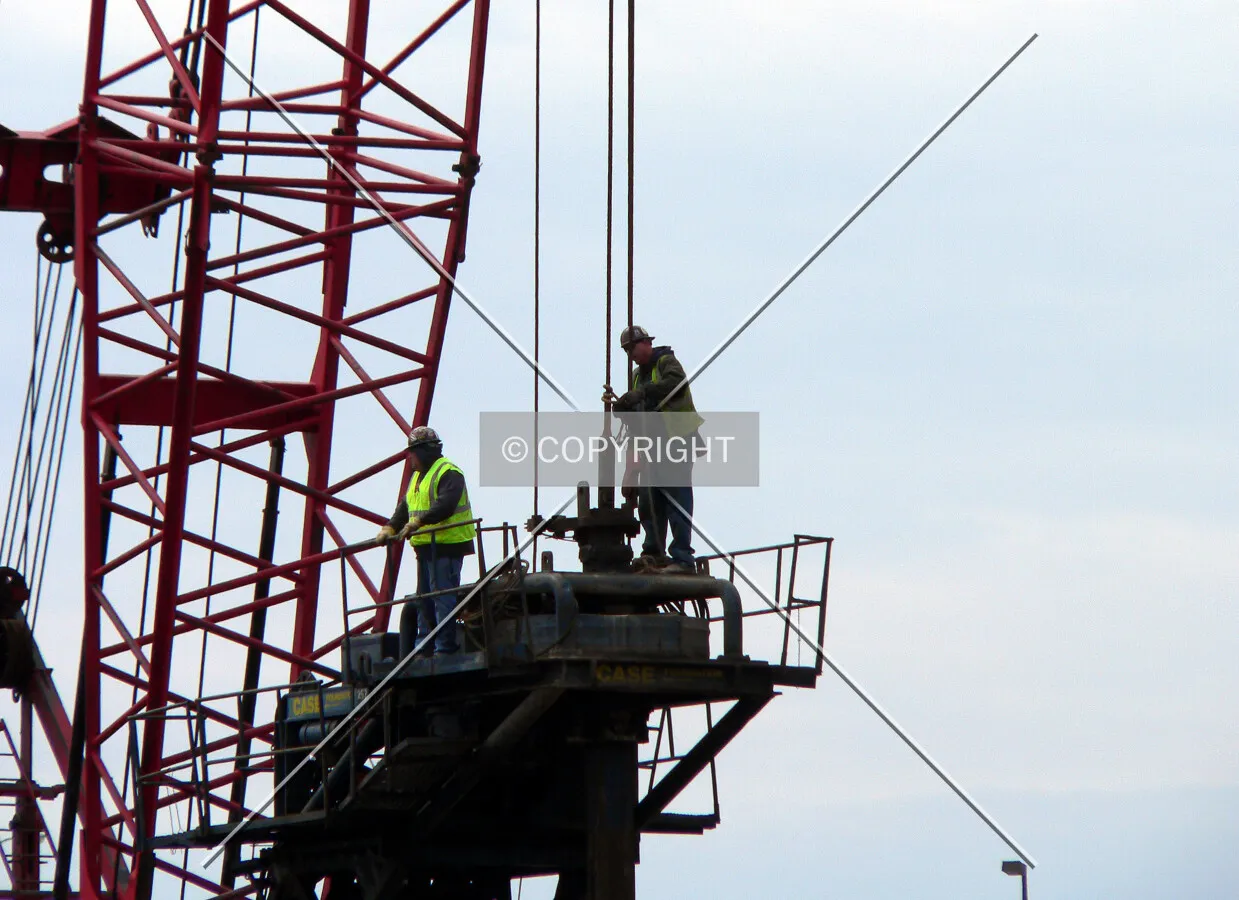 Workers on a caisson motor