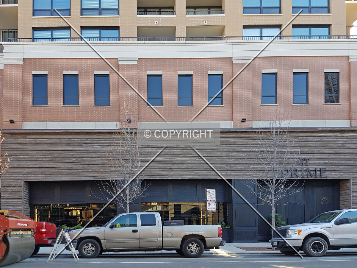 Cars parking in front of the building at the street