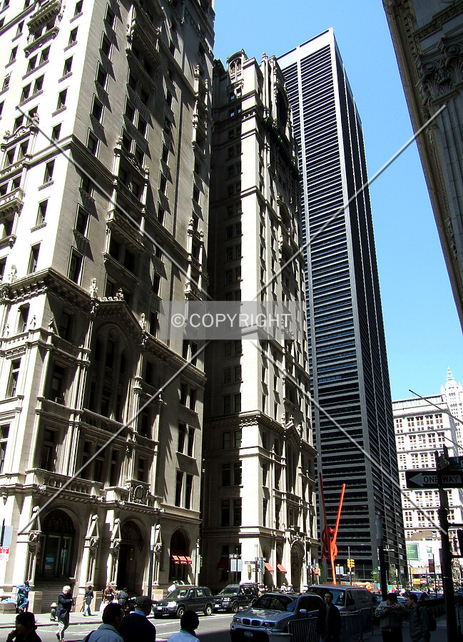 View from the southwest on Broadway between the Trinity Building and One Liberty Plaza