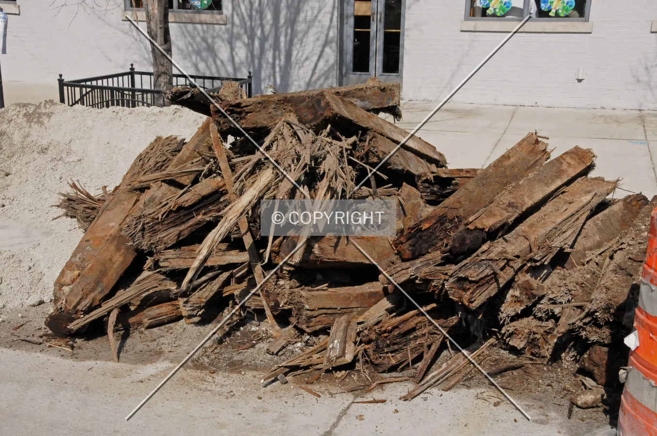 Old railroad ties ripped up from under Erie Street while new water pipes are installed to serve the new tower