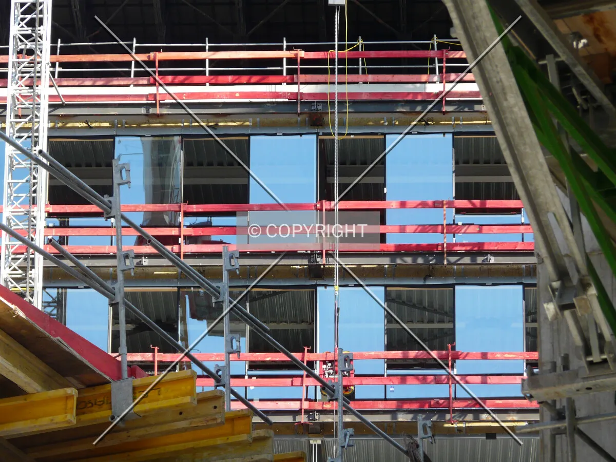 New curtain wall being installed on the west side
