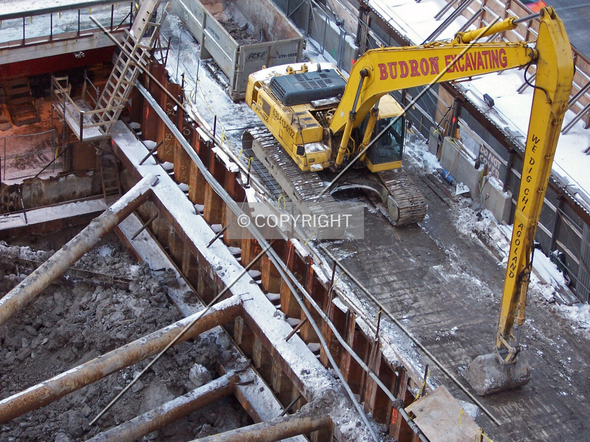 Backhoe excavator at the northeast corner of the site
