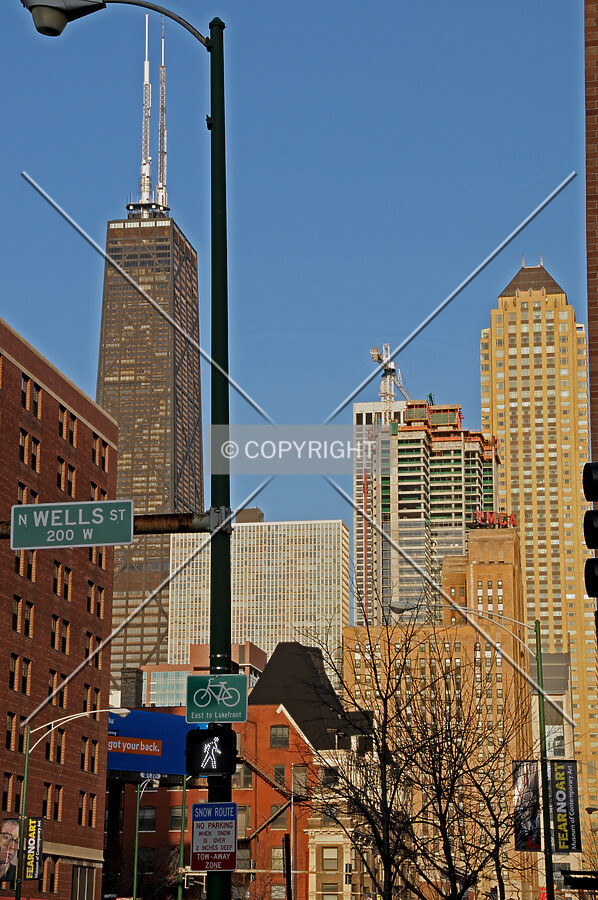 Looking east from the intersection of Wells Street and Chicago Avenue in the late afternoon