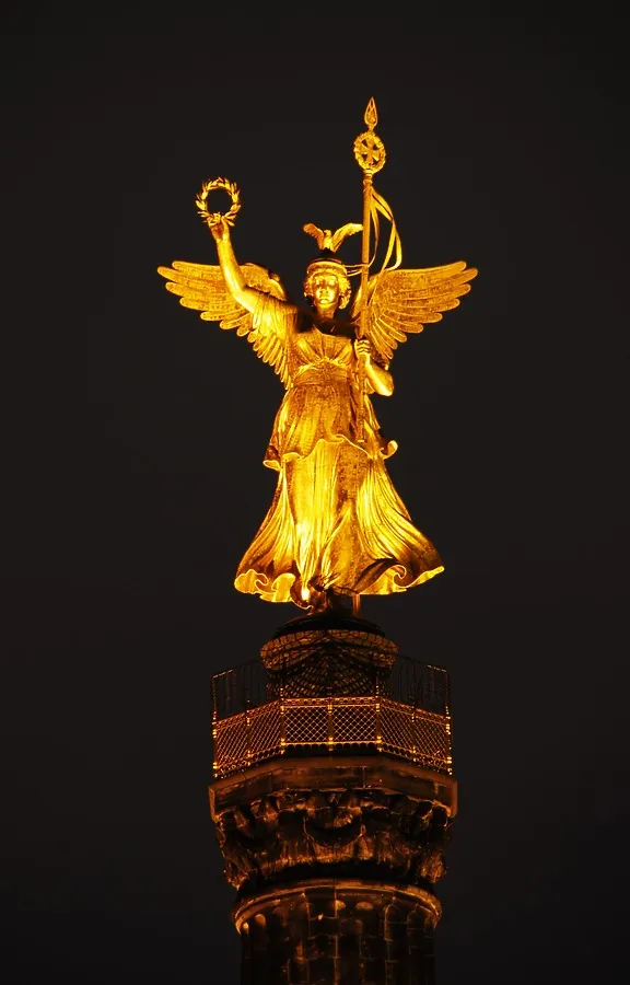 Golden angel shining at night