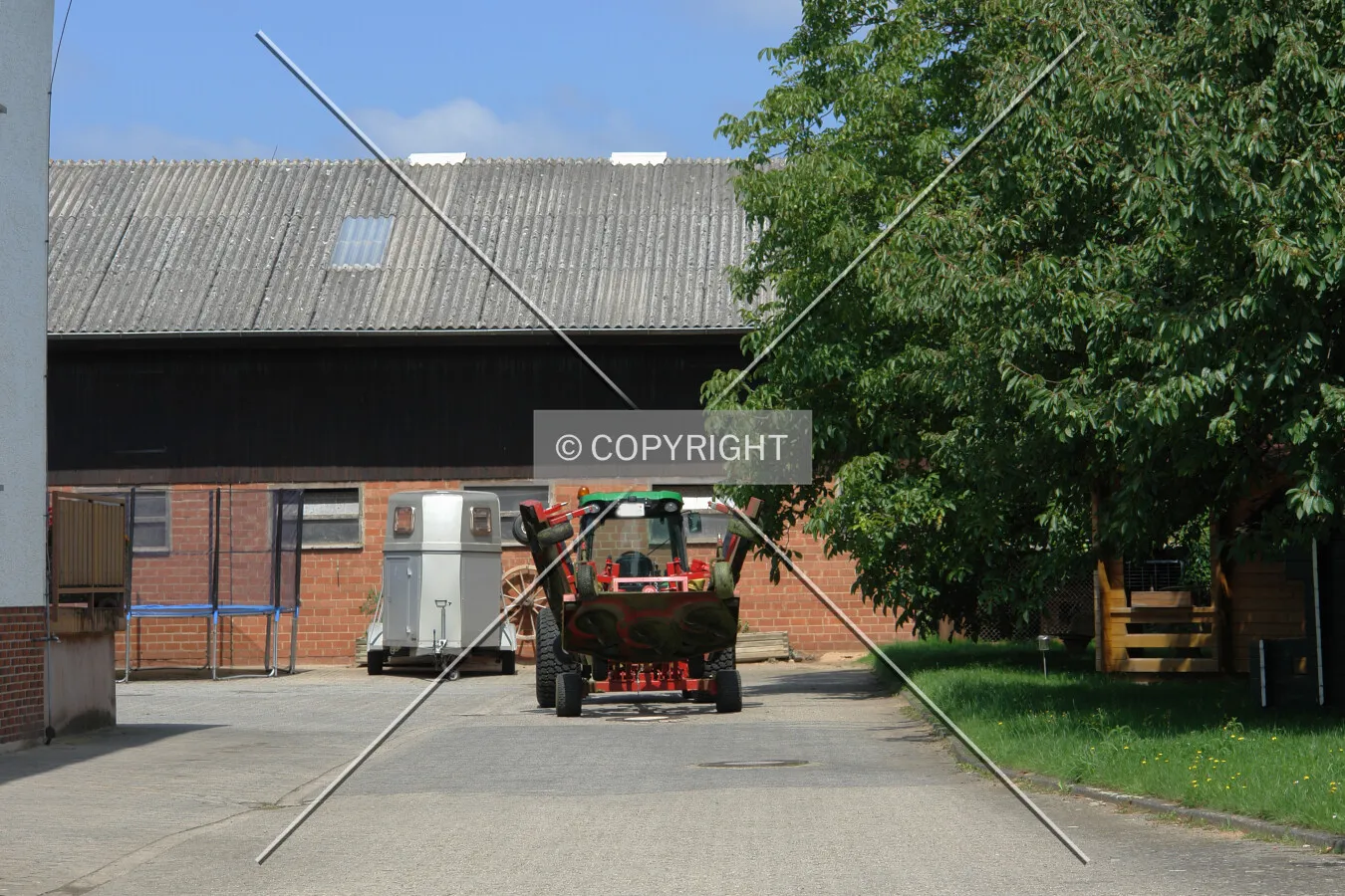 Tractor in front of a barn