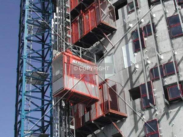 People moving up and down in the construction elevator