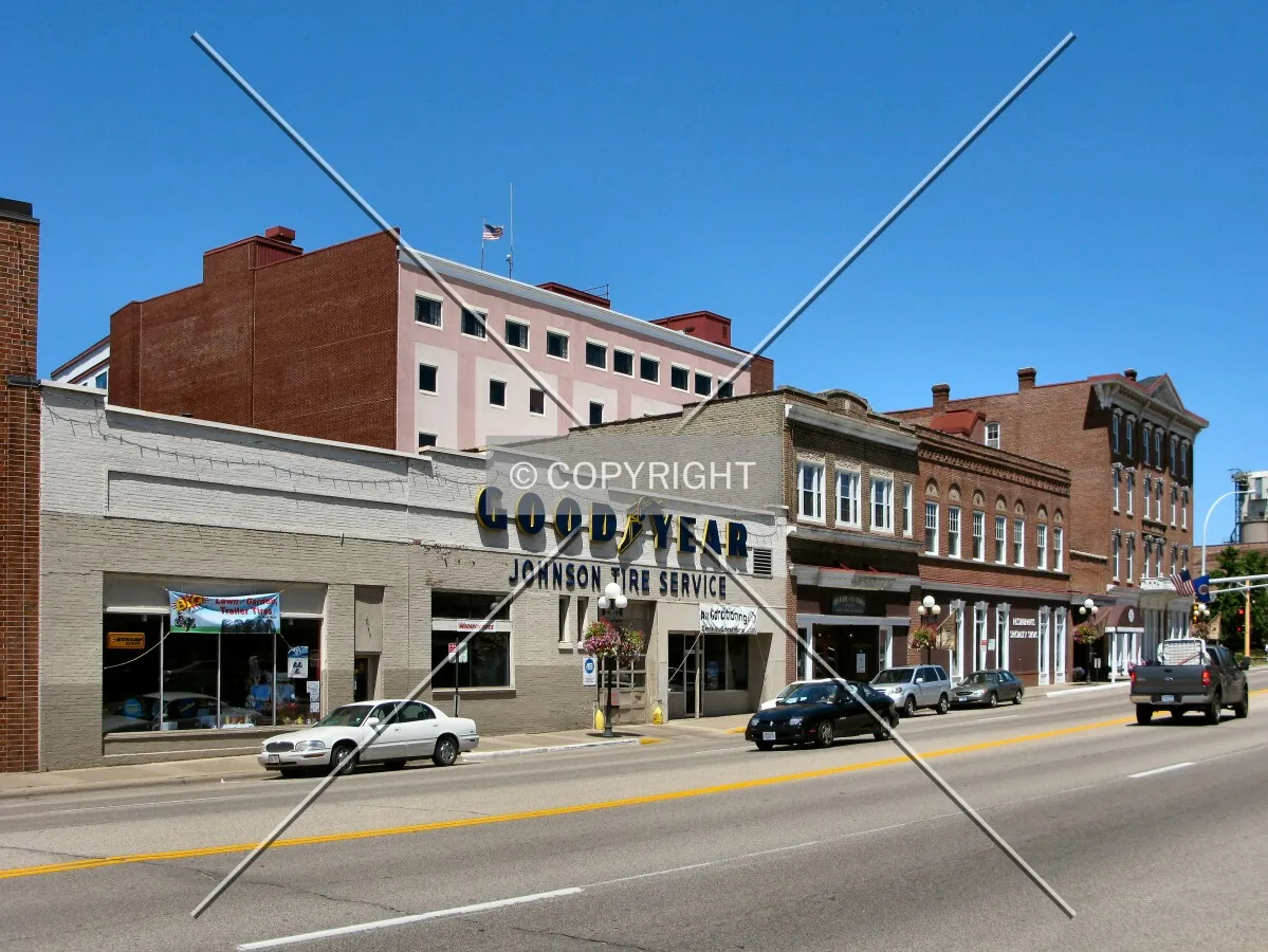 View to the north across West Main Street, modern addition rising above historic storefronts