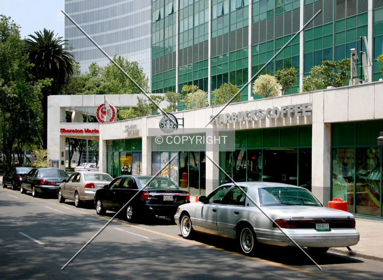 Ground level shops along the south facade