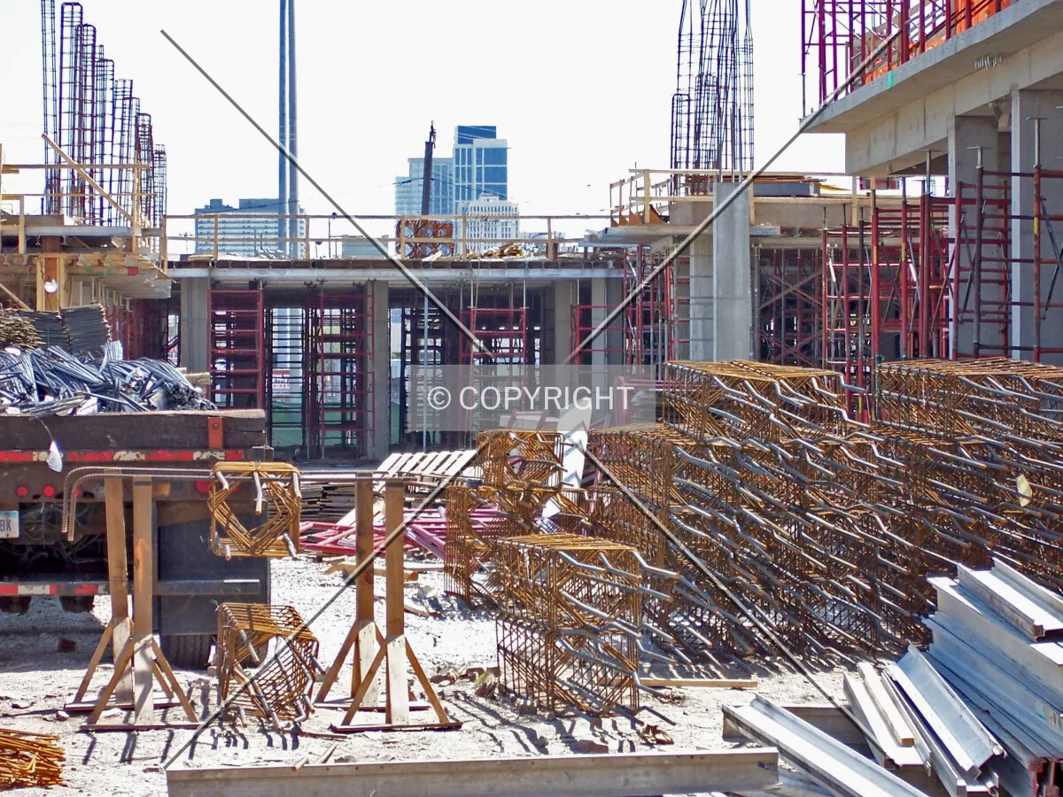 Looking east from Halsted Street; a stack of assembled rebar cages lie in the foreground