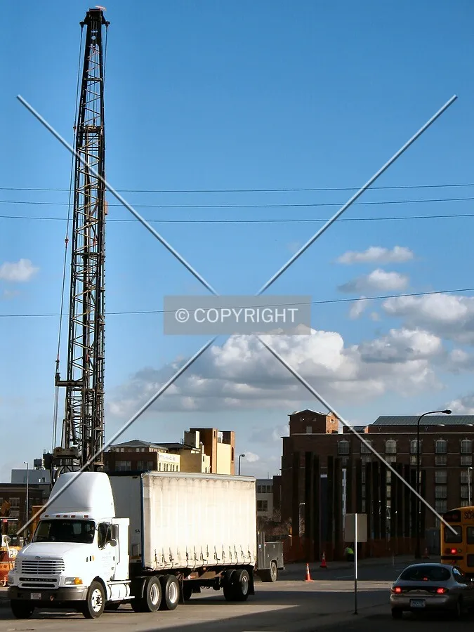 View to the south across Jackson Street, with a piledriver installing new H-piles along the site's western edge