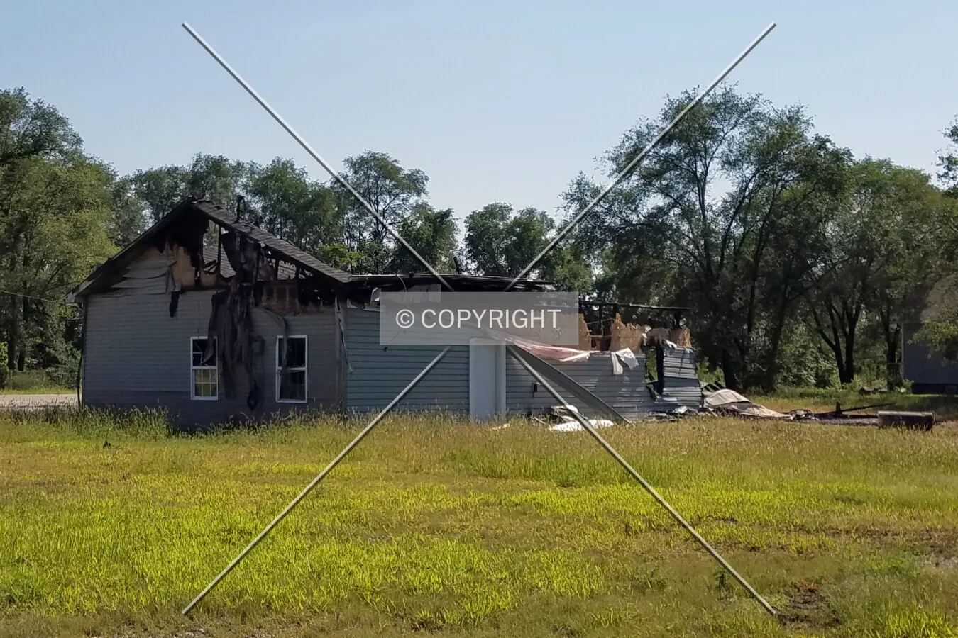 View from the northwest after being damaged by fire; August 24, 2017
